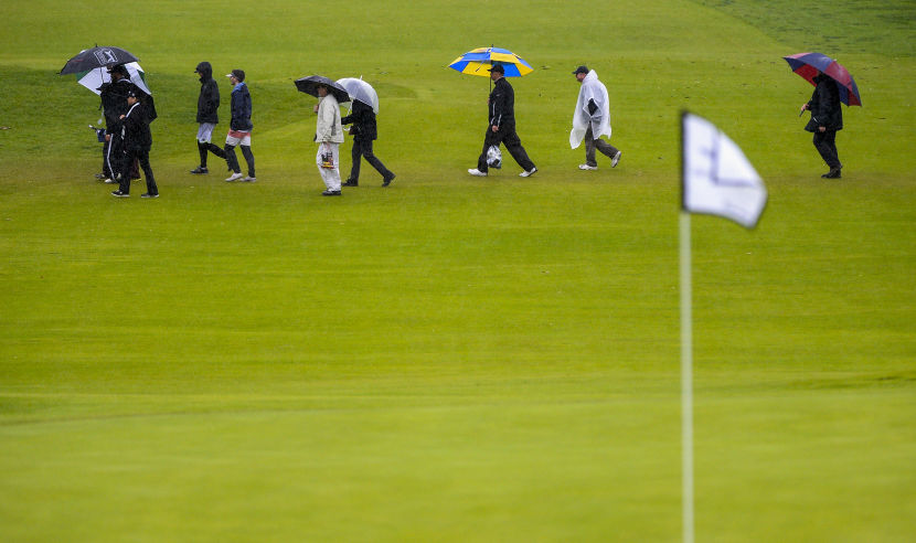 PACIFIC PALISADES, CA - FEBRUARY 17:  Patrons exit the course as play is called due to inclement weather during the second round at the Genesis Open at Riviera Country Club on February 17, 2017 in Pacific Palisades, California.  (Photo by Robert Laberge/Getty Images)