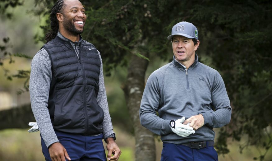 PEBBLE BEACH, CA - FEBRUARY 09:  Larry Fitzgerald and Mark Wahlberg stand on the 5th tee during Round One of the AT&T Pebble Beach Pro-Am at Monterey Peninsula Country Club on February 9, 2017 in Pebble Beach, California.  (Photo by Jeff Gross/Getty Images)
