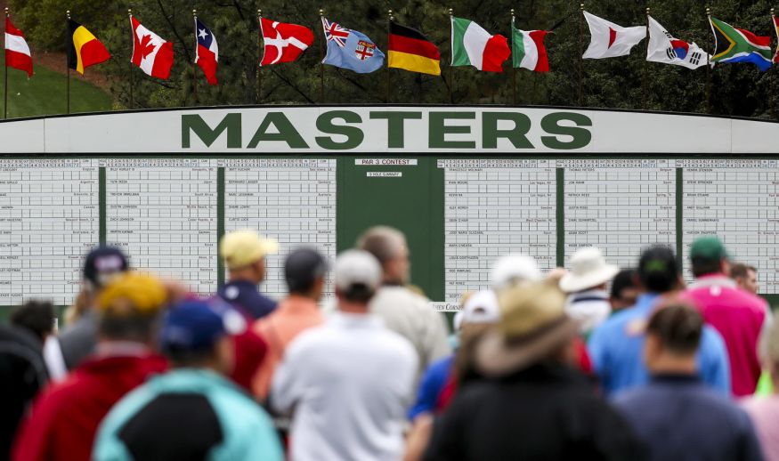 AUGUSTA, GA - APRIL 03:  Patrons walk past a leaderboard next to the first fairway during a practice round prior to the start of the 2017 Masters Tournament at Augusta National Golf Club on April 3, 2017 in Augusta, Georgia.  (Photo by Rob Carr/Getty Images)