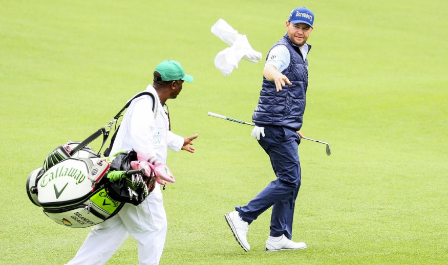 AUGUSTA, GA - APRIL 03:  Branden Grace of South Africa tosses a towel to his cadide Zack Rasego during a practice round prior to the start of the 2017 Masters Tournament at Augusta National Golf Club on April 3, 2017 in Augusta, Georgia.  (Photo by Andrew Redington/Getty Images)