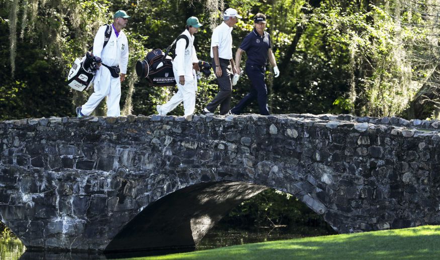 AUGUSTA, GA - APRIL 04:  Bernhard Langer of Germany crosses the Nelson bridge with caddie Terry Holt during a practice round prior to the start of the 2017 Masters Tournament at Augusta National Golf Club on April 4, 2017 in Augusta, Georgia.  (Photo by David Cannon/Getty Images)