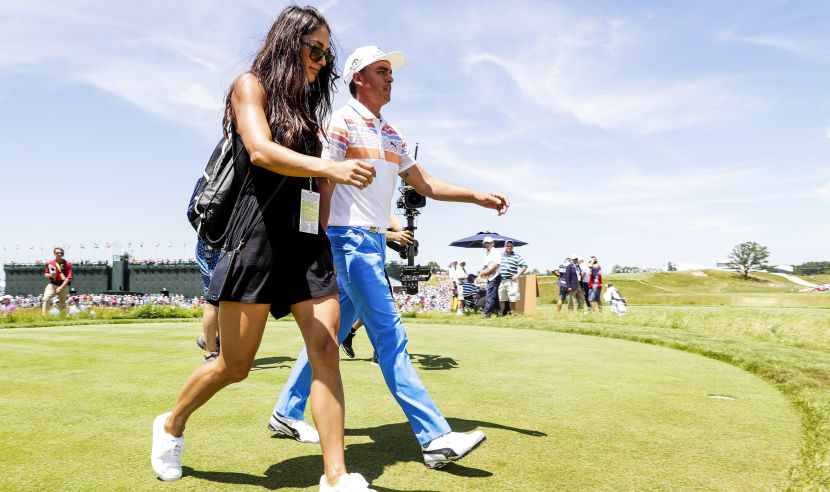 HARTFORD, WI - JUNE 15:  Rickie Fowler of the United States walks from the ninth green with Allison Stokke after finishing during the first round of the 2017 U.S. Open at Erin Hills on June 15, 2017 in Hartford, Wisconsin.  (Photo by Jamie Squire/Getty Images)