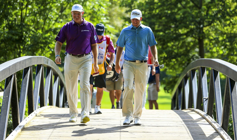 OAKVILLE, ON - JULY 28:  Ernie Els of South Africa and Tom Hoge of the United States walk toward the 11th hole during the second round of the RBC Canadian Open at Glen Abbey Golf Club on July 28, 2017 in Oakville, Canada.  (Photo by Vaughn Ridley/Getty Images)