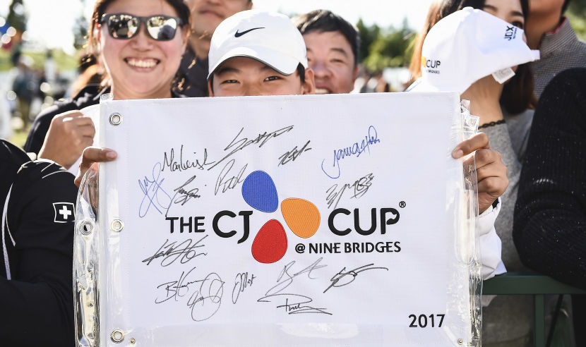 JEJU, SOUTH KOREA - OCTOBER 20: Fans hold event flags with the signatures they have collected during the second round of the CJ Cup at Nine Bridges on October 20, 2017 in Jeju, South Korea.  (Photo by Matt Roberts/Getty Images)