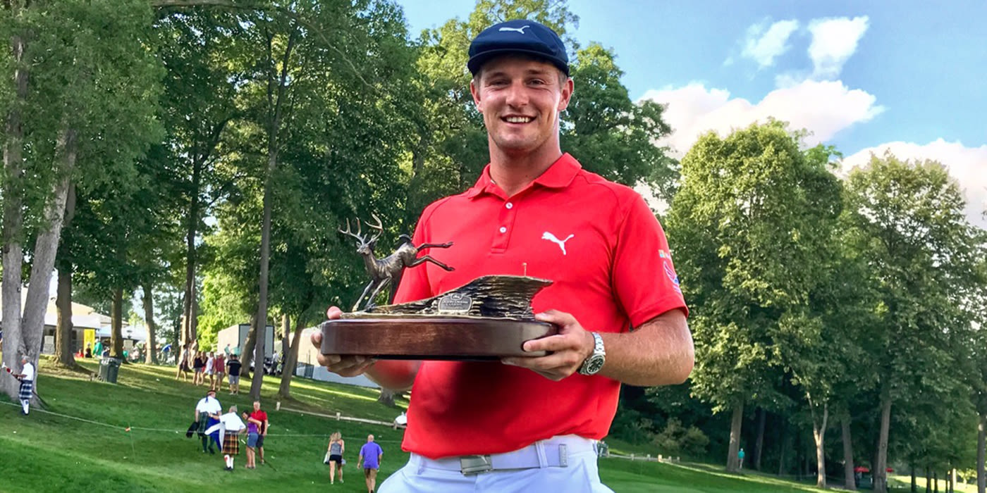 Bryson DeChambeau with John Deere trophy
