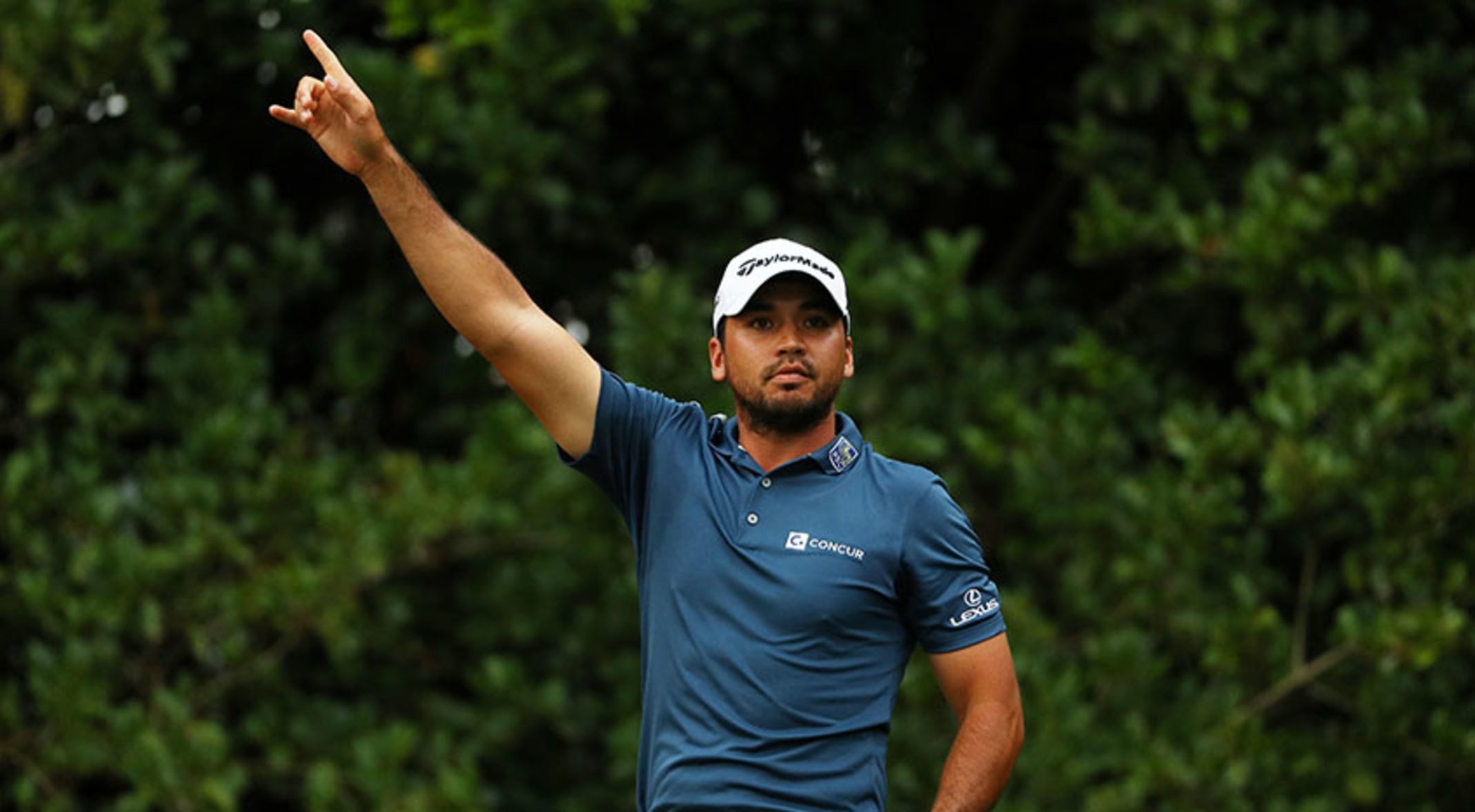 Day stays the course in weather-marred second round