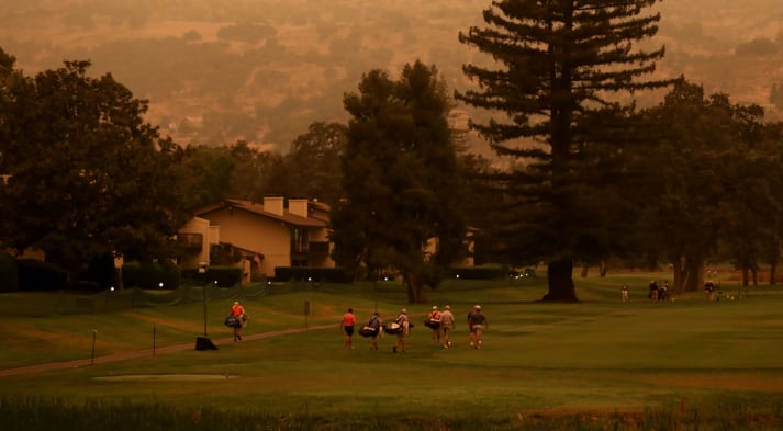 Golfers warm up on the driving range during the preview day of the Safeway Open. (Jed Jacobsohn/Getty Images)
