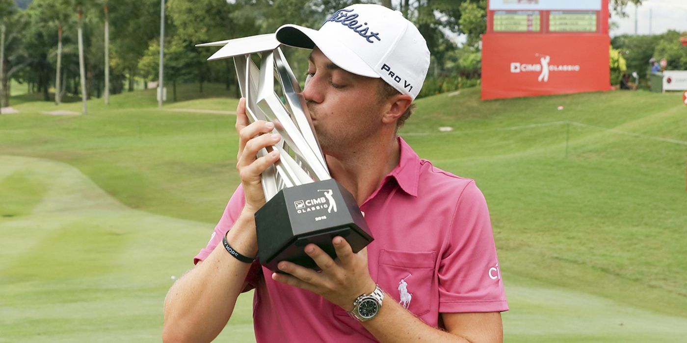 JT kisses his 2nd CIMB trophy