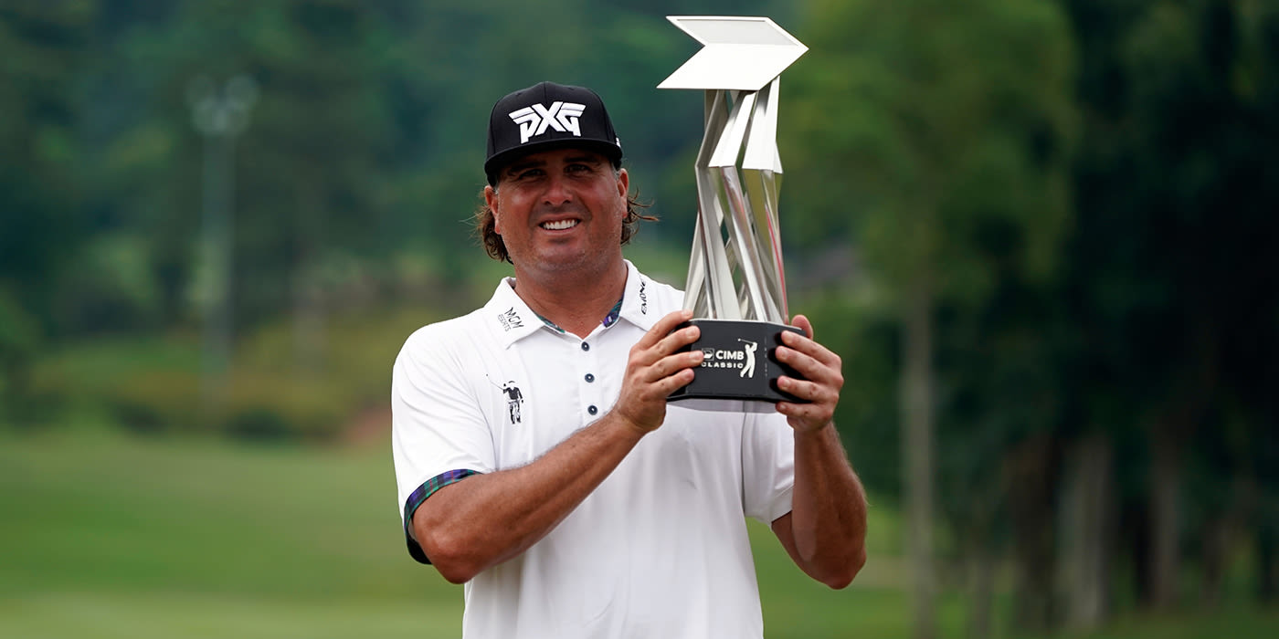 Pat Perez hoists the CIMB trophy