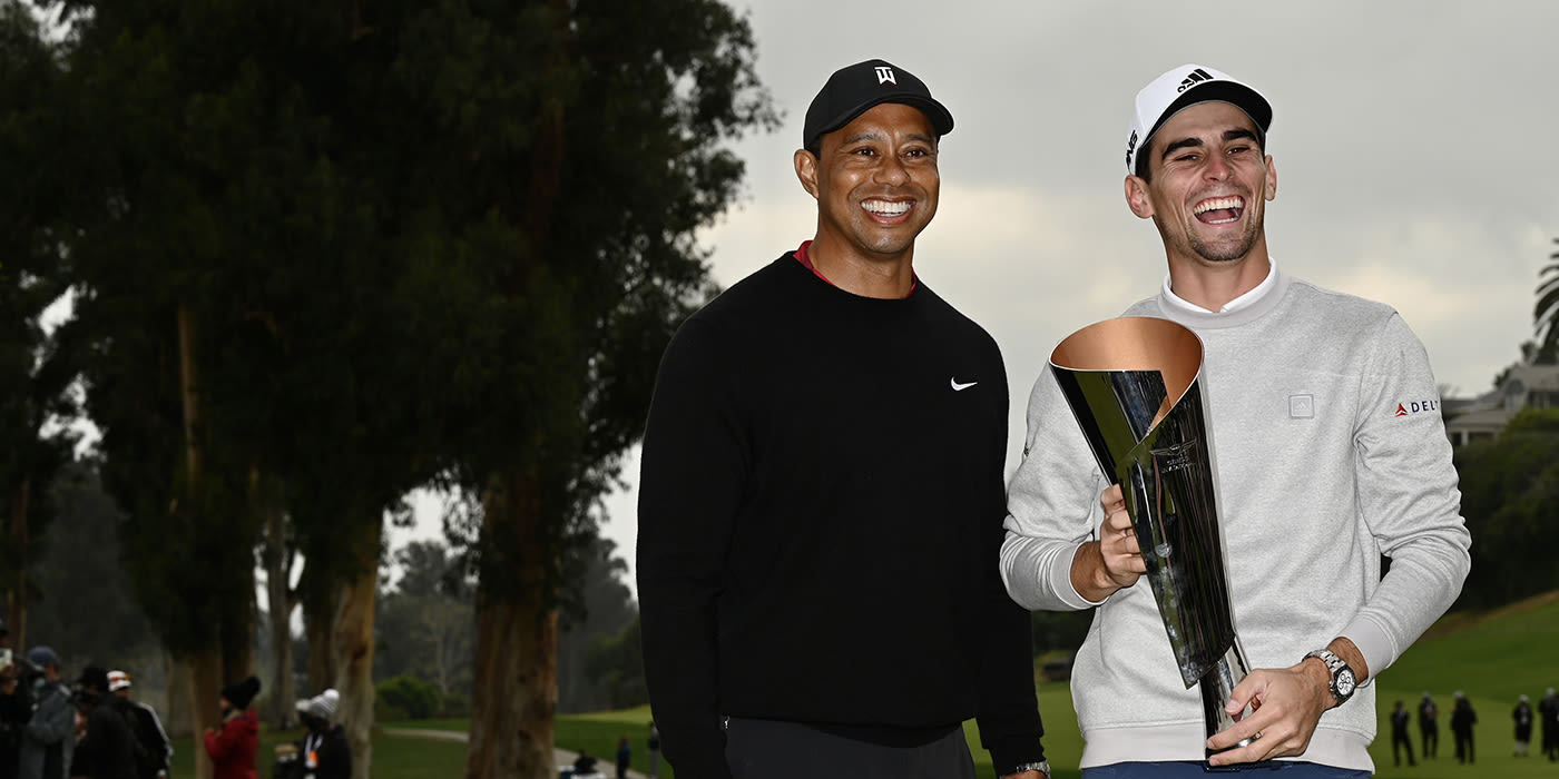 Joaquin Niemann with Genesis trophy and host Tiger Woods