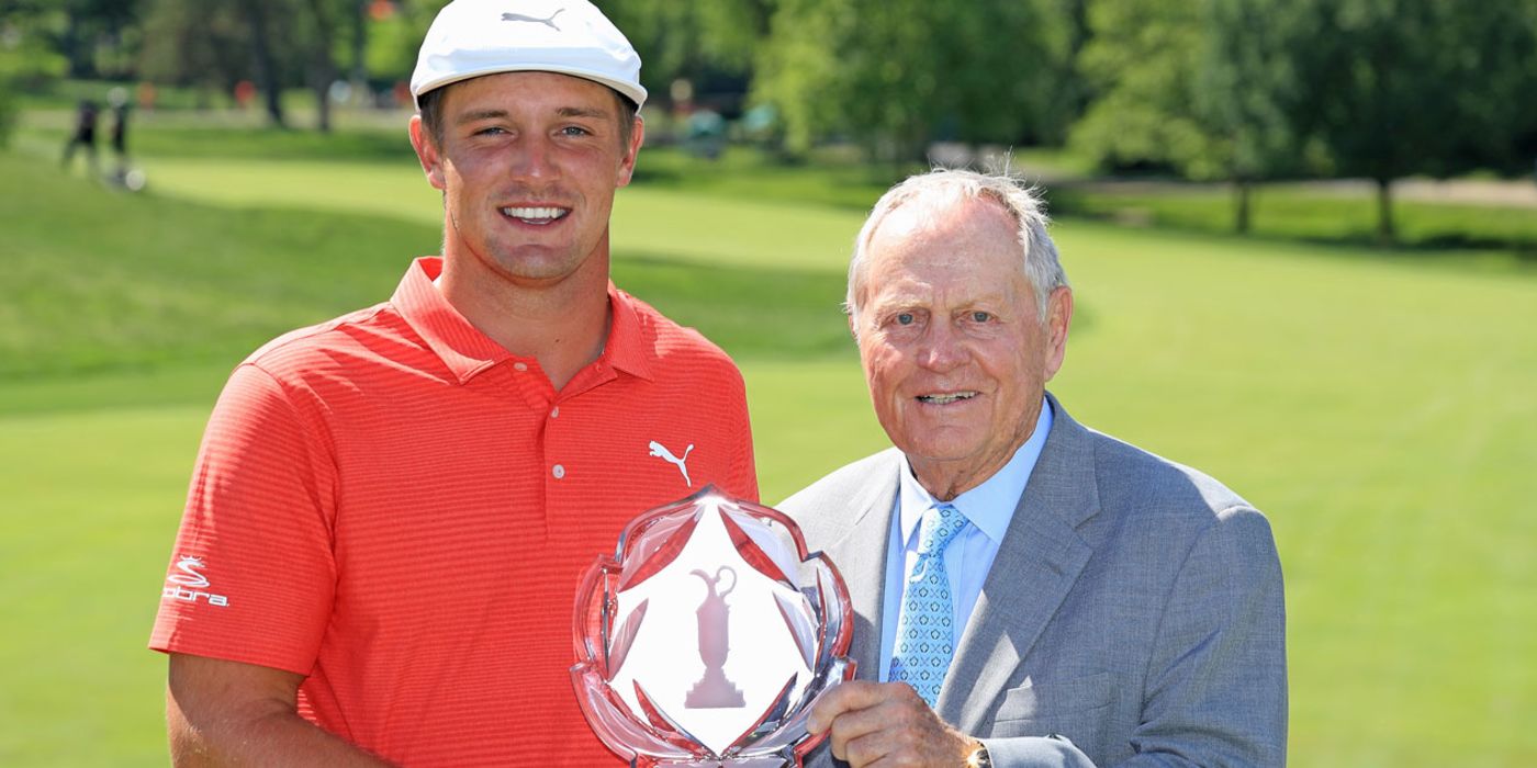 Bryson DeChambeau with Memorial trophy and Jack Nicklaus
