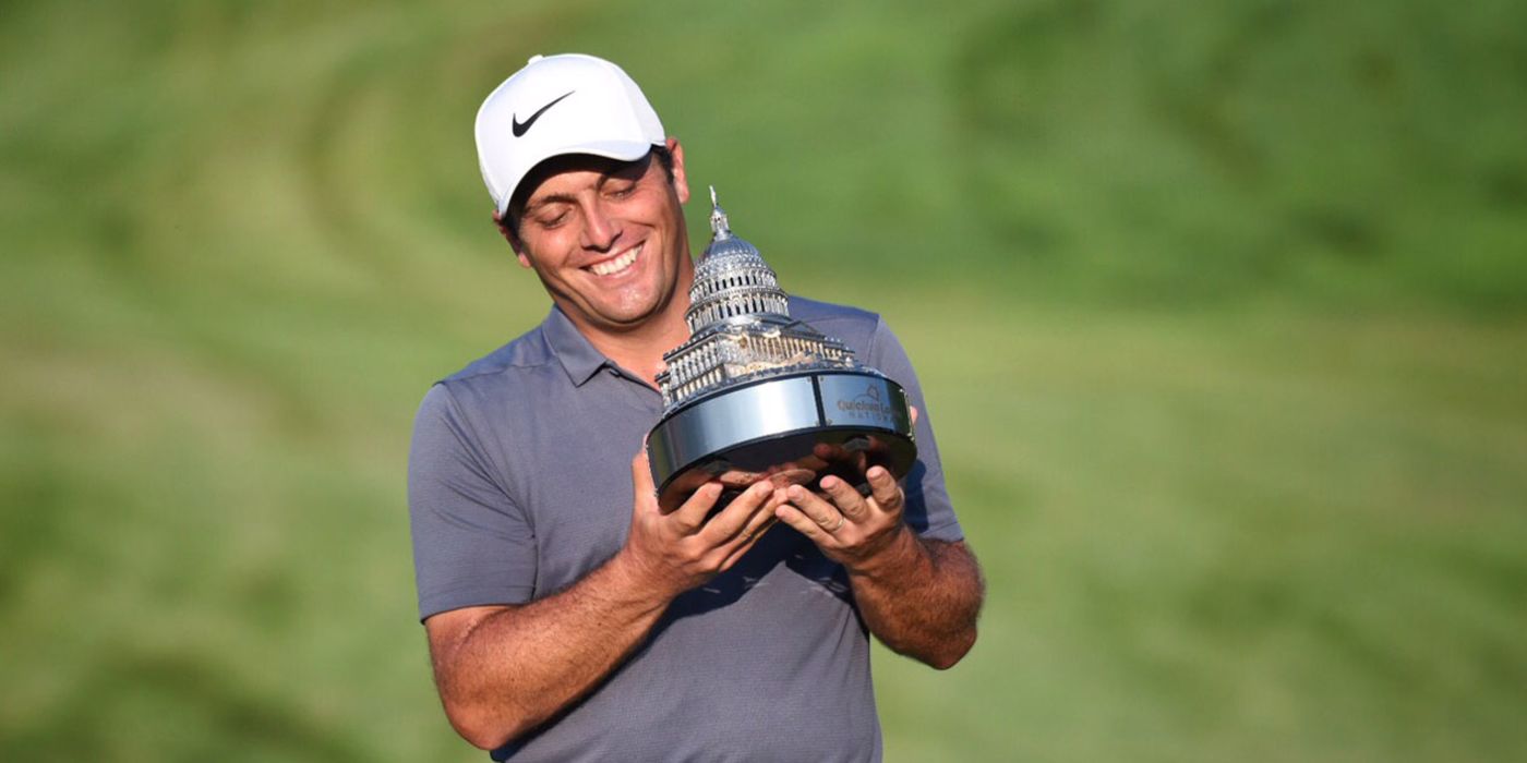 Francesco Molinari holds the Guicken Loans trophy