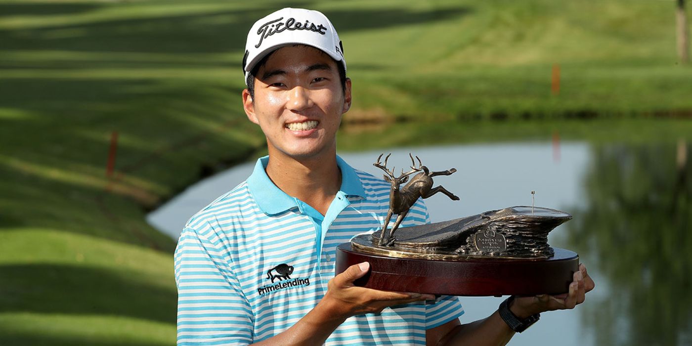 Michael Kim with Deere trophy