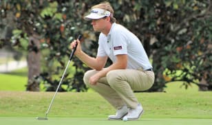 Hitt remains on top, shooting a second-round, even-par in big wind