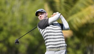 Wolfe continues strong play, opens three-shot lead