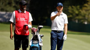 Jordan Spieth and caddie looking for an edge in reading putts