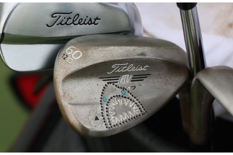 Nick Watney's custom shark-stamped Titleist Vokey SM7 D-grind wedge. He also has new Titleist 620 MB irons in the bag.